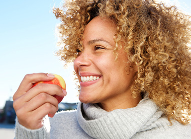 Woman eating apple